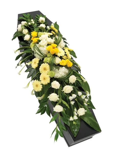 Yellow and White Casket Spray Flowers for the casket are usually chosen by the immediate family of the deceased, so if you are a more distant relative or friend, it may be more appropriate to send a smaller arrangement or plant, or to place a wreath at the graveside. You can also send sympathy flowers for the family of the deceased to their home where they can enjoy them for longer. If it's appropriate for you to send funeral flowers, you can see a wide range which we have picked here